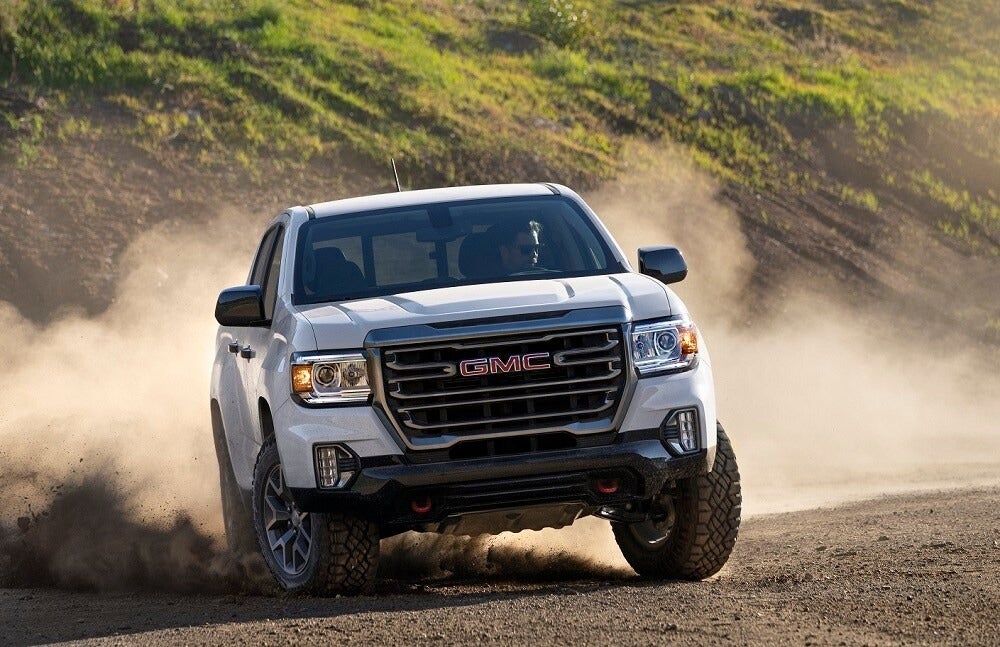 A GMC vehicle running in forest
