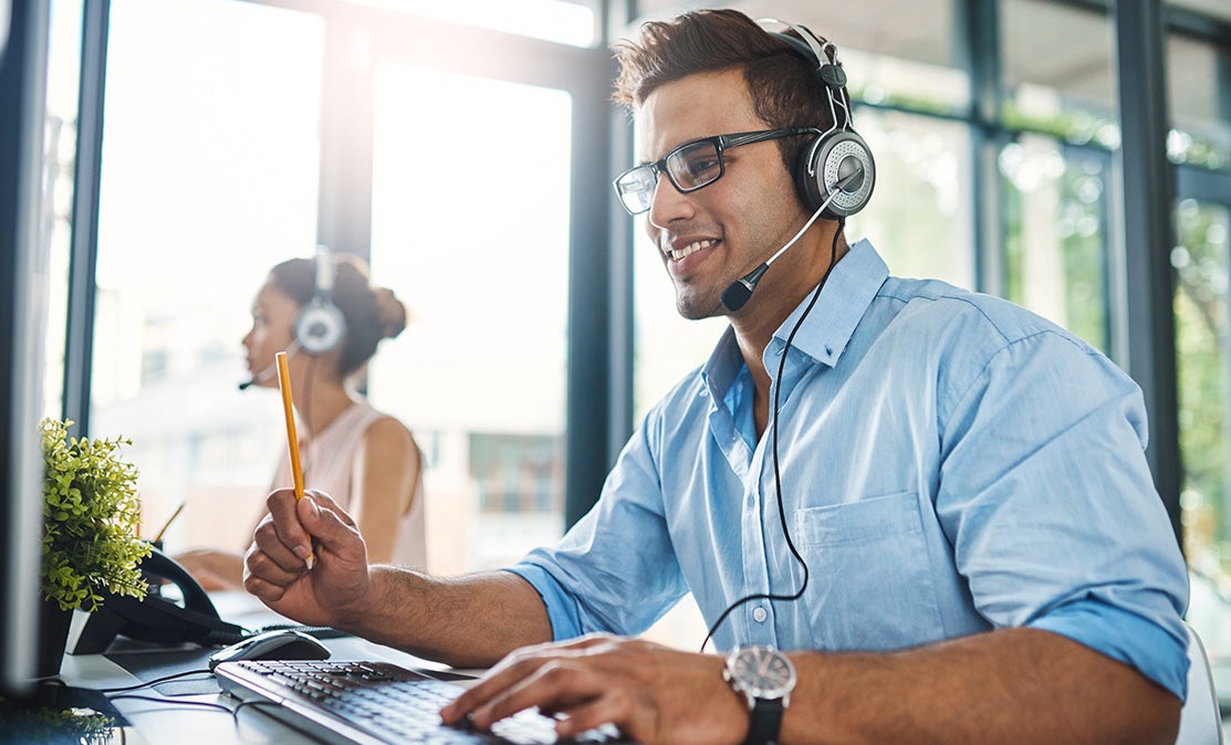 A men and women wearing headphones