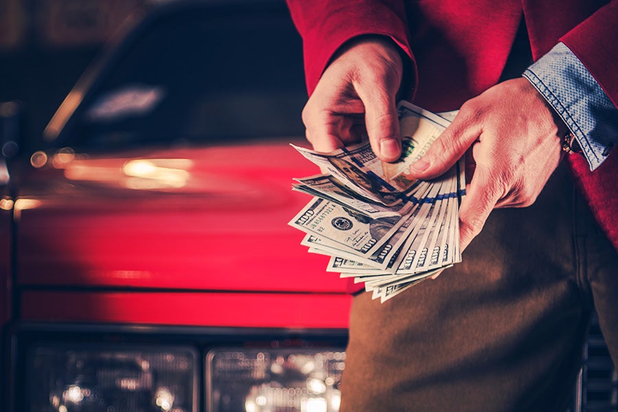 A person counting a cash